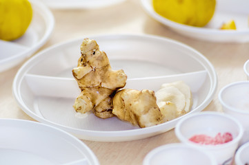 Jerusalem artichoke on a white plastic plate