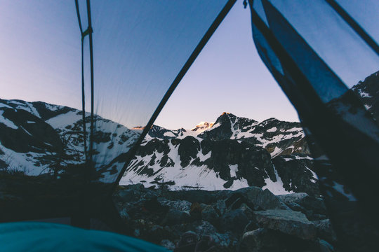 View of a mountain sunset from the inside of a tent