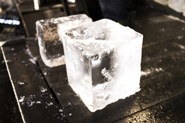 pair of ice cubes on black background