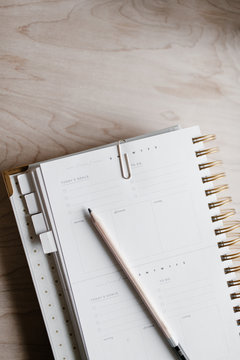 Blank daily planner and pencil