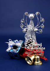 Merry Christmas with gift box and decoration with blue backdrop.