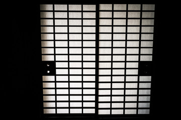 dark traditional Japanese doors with bright translucent paper