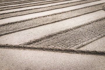 detailed pattern in the sand at the temple