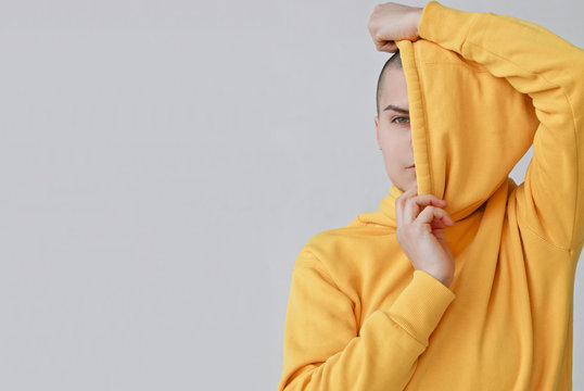 Studio portrait of bald woman