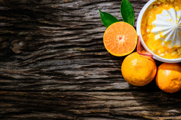 Fresh orange on wooden table from top view