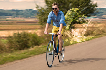 Naklejka premium Gorgeous biker in the nature going somewhere with ethereal concept