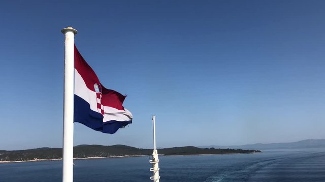 Croatian flag on a ferry while leaving Split Croatia with a ferry