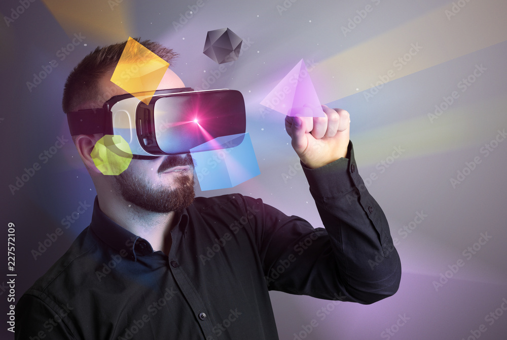 Poster amazed businessman with virtual reality colorful geometric shapes in front of him