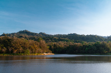 Fototapeta na wymiar Natural landscape lake mountain view blue sky with the forest in Thailand .