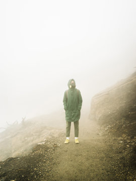 Person in misty vapors of sulfur