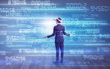 Businessman in vr glasses with variable fast changing numbers around
