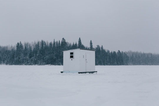 Fish house on frozen lake.