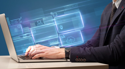 Hand typing on laptop with online accounting system concept
