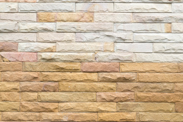 Beautiful dark yellow and white stone wall background in horizontal pattern