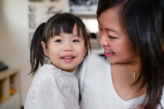 Asian Mother and Daughter Spending Time Together at Home