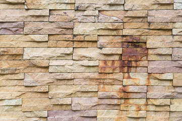 Rust - burned yellow stone wall background