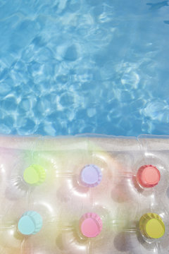 Details of a transparent air mattress on the water in Summer time