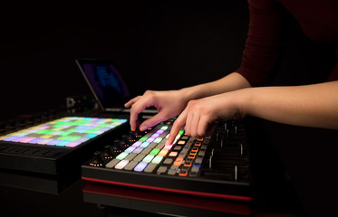 Fototapeta premium Dj hand remixing music on midi controller 