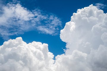 Fototapeta na wymiar Blue sky with fluffy white clouds