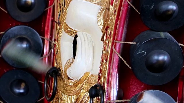 Playing a traditional musical instrument Khong Wong, close up view, Thailand. Musician playing on Kong wong - Thai musical instrument.