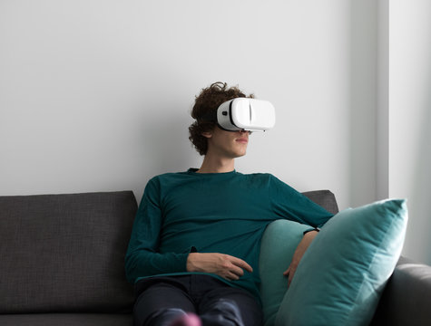 Young man chilling in VR goggles