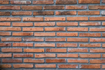Naklejka premium weathered old brown brick wall pattern for background