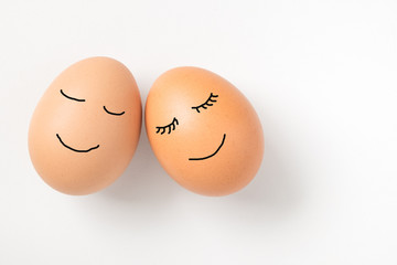 Couple eggs with happy face for love concept