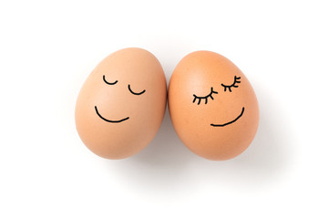 Couple eggs with happy face for love concept