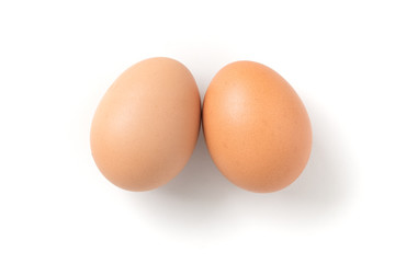 Couple brown chicken egg on white background