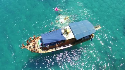 People enjoy the ocean on a boat.