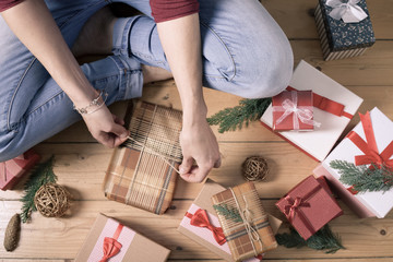 woman wrapping christmas presents