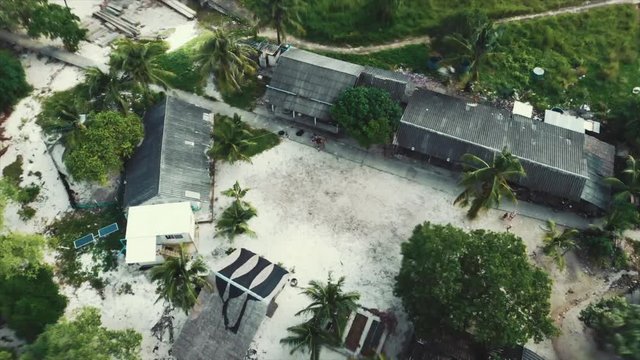 Children waving to the camera.  Asteroid mode style. Mavic Air shot