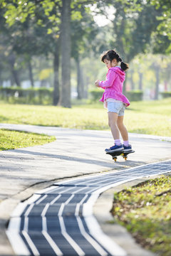 kid playing waveboard in park