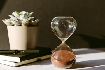 A sand timer through which all of the sand has run, indicating that time is up.