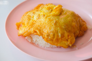 Thai style pork omelette on hot steamed rice