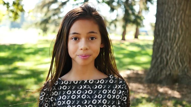 Happy eleven-year-old girl smiles