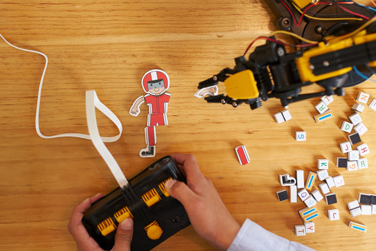 Boy playing with a robot