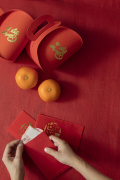 Preparing hongbao (red envelope)