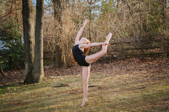 a young dancer performing in nature