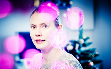 beautiful woman portrait and bokeh christmas lights