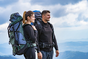 Fototapeta premium The happy couple standing on the mountain