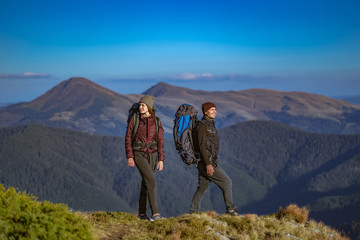 Fototapeta premium The happy couple walking on the mountain