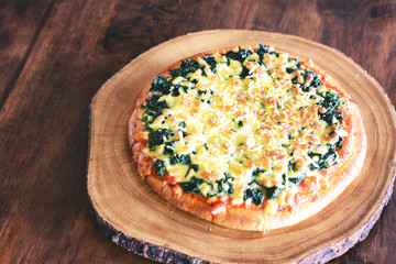 Pizza on wooden board