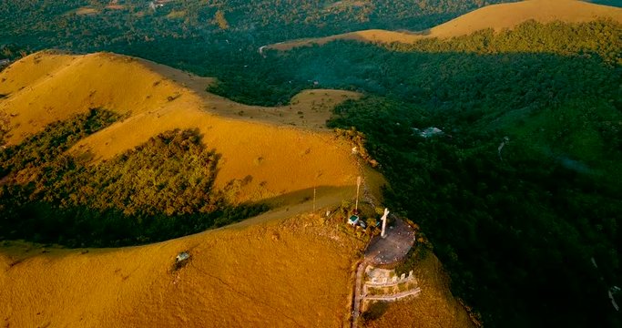 Aerial - drone flying over the hill with a cross. Mt Tapyas in Coron, Palawan, Philippines.
