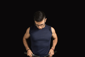 Fototapeta na wymiar Man exercising with dumbbells, shoulder exercise