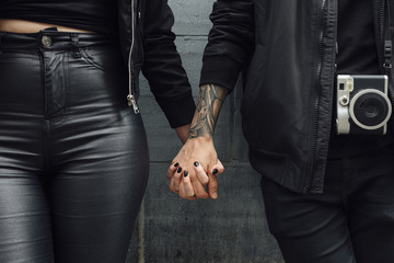 Young Couple Hand in Hand . Close up