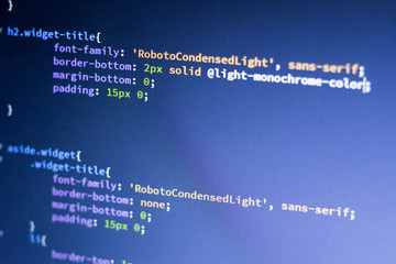 Web development code: CSS/LESS styles preprocessor script lines. Abstract screen of web developer.