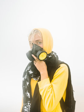 Traveler in sulfur vapors on volcano