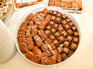 Baklava,and various traditional oriental sweets round pastry cookies with nuts in an restaurant  display.