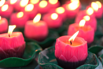 Flower candles burning at night.